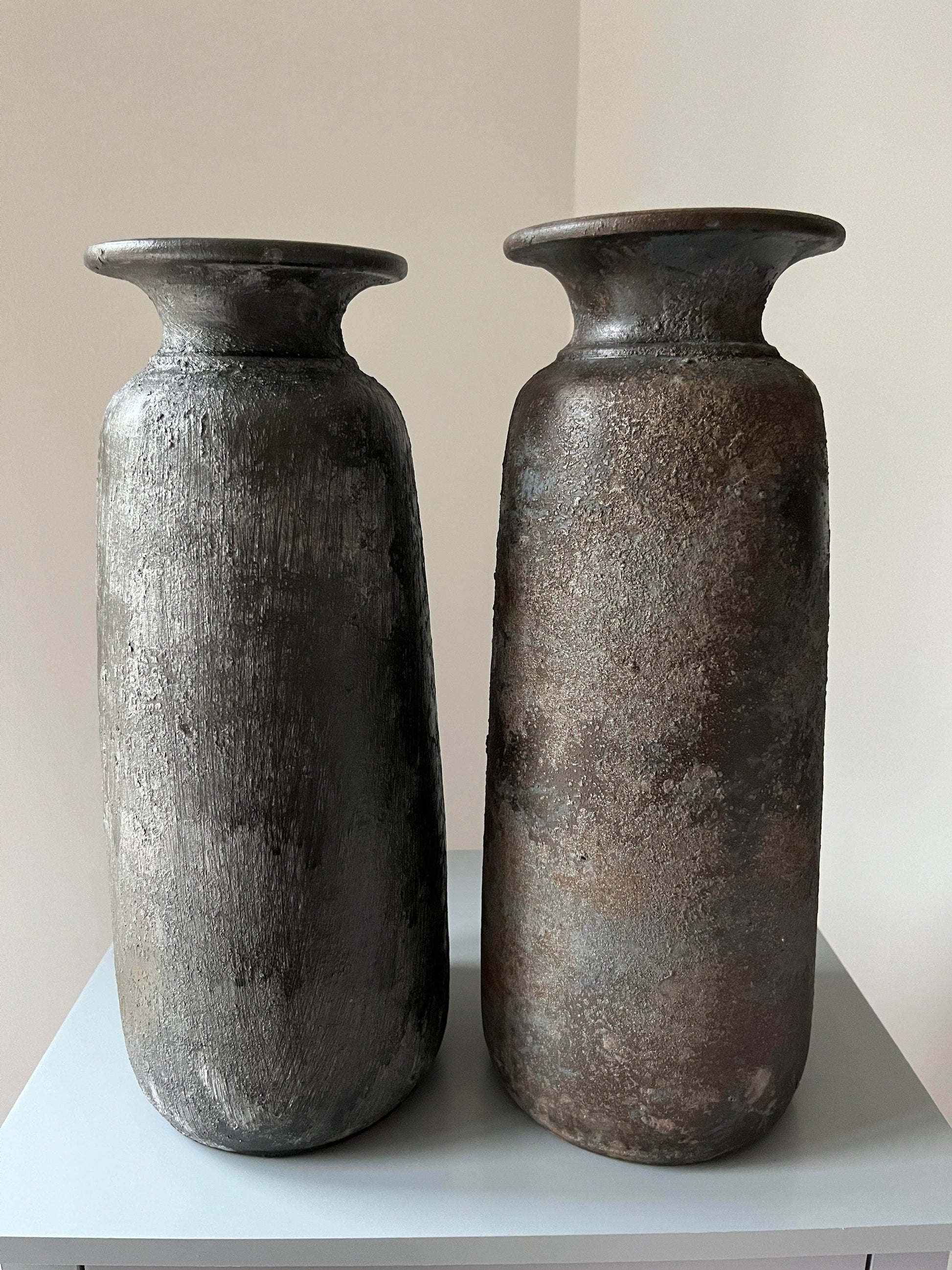 Two tall bali vases 