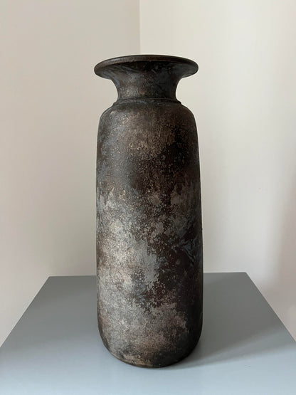 Tall bali vase displayed on a table