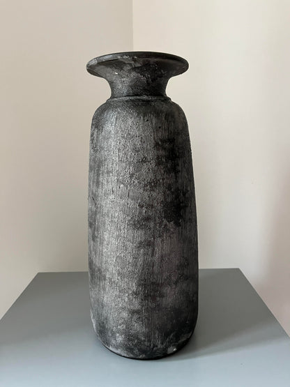 Tall bali vase displayed on a table