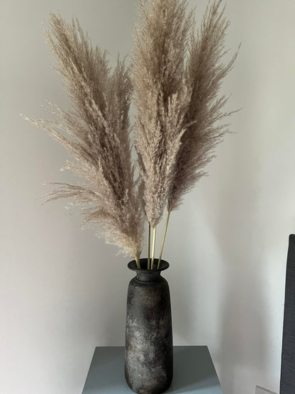 Fluffy pampas grass in a tall bali vase