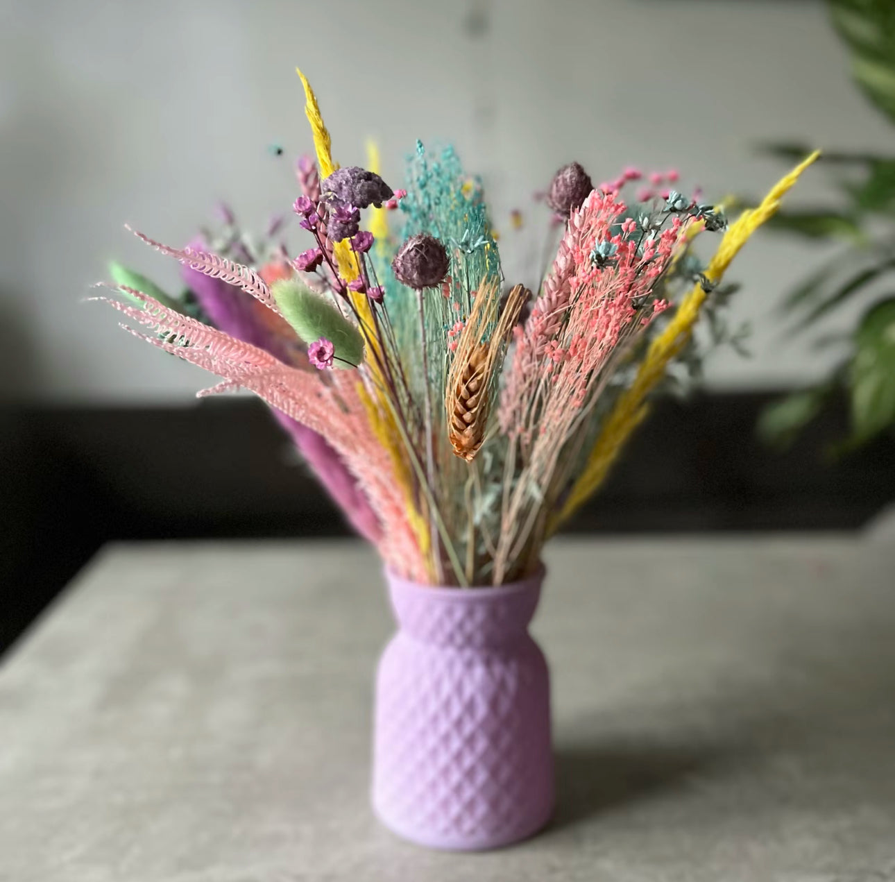 Purple meadow glass vase displayed on the table with dried flowers