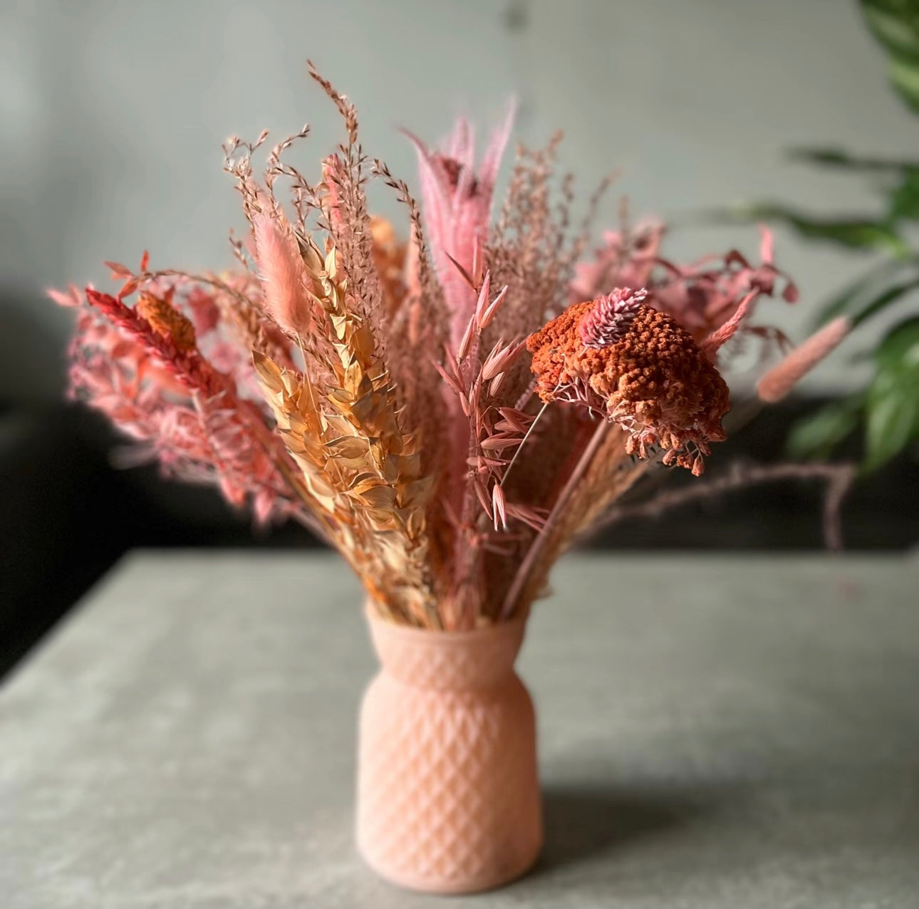 Pink meadow glass vase displayed on the table with dried flowers