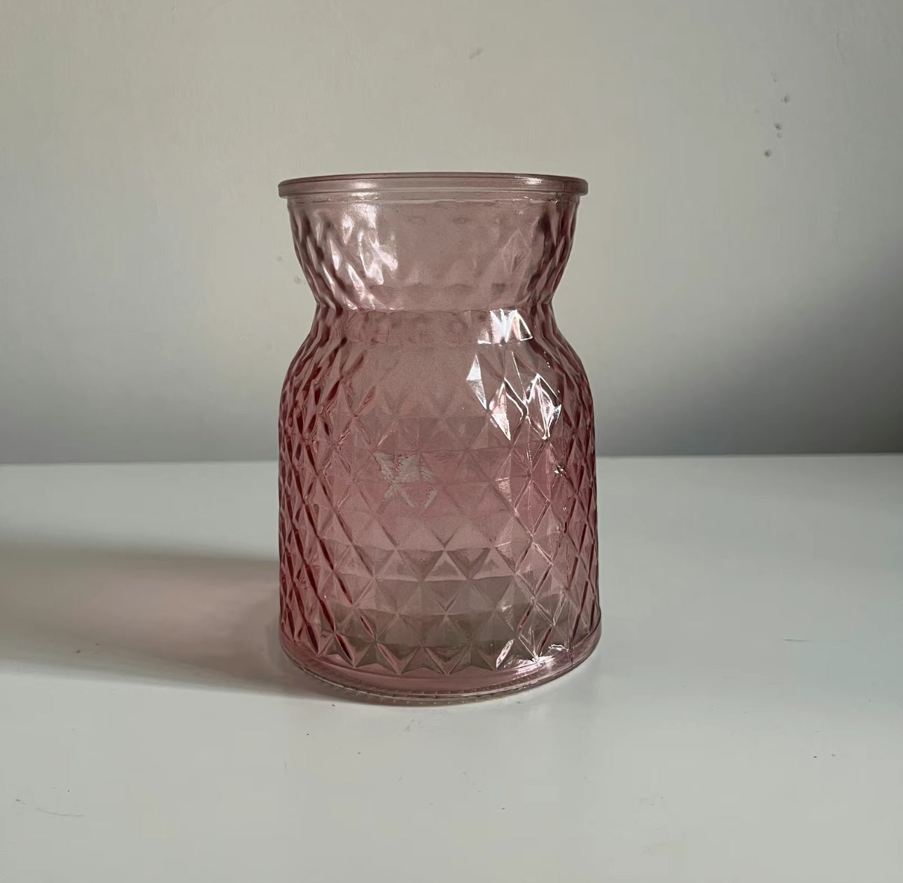 Clear pink meadow glass displayed on a table