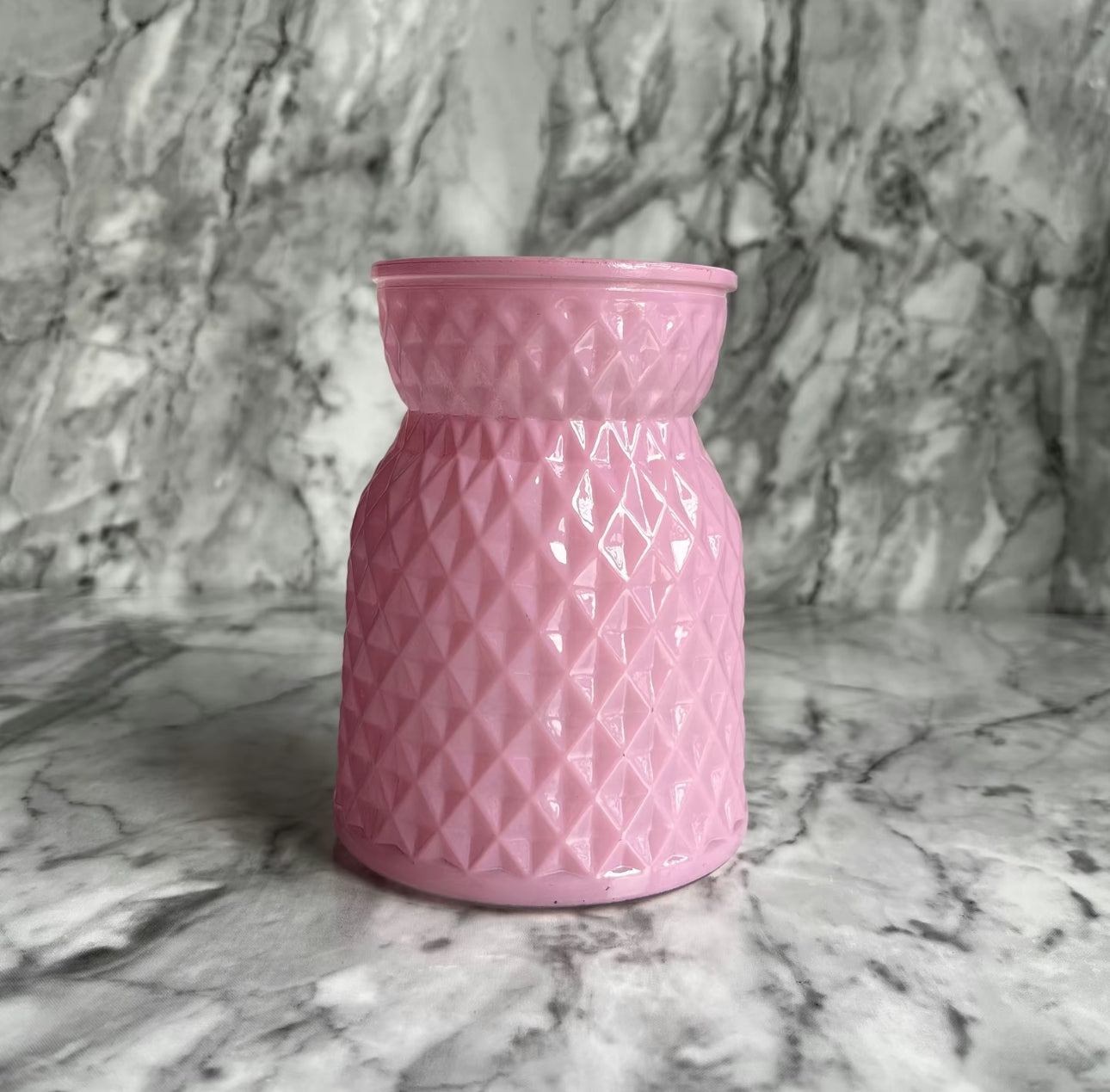 Light pink satin meadow glass displayed on a table