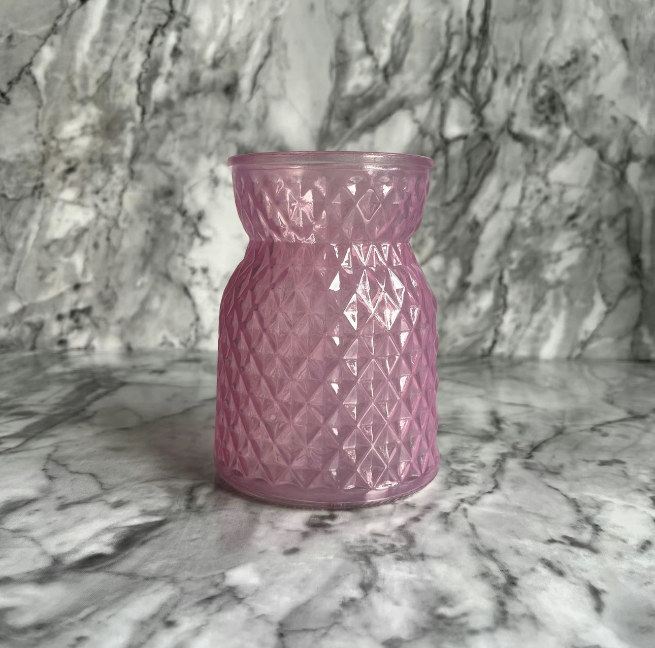 Pink meadow glass displayed on a table