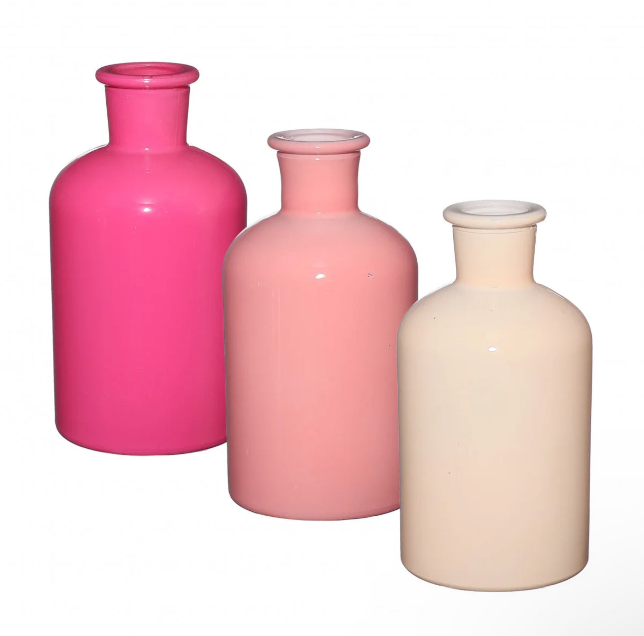 Dark pink, light pink and cream vases on a white background