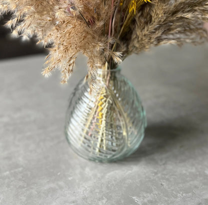 Clear glass leaf vase displayed on a table