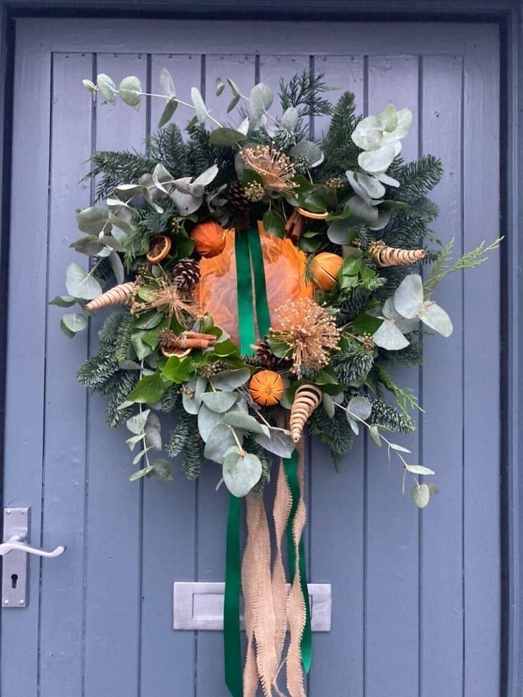 Christmas wreath example hung on a door